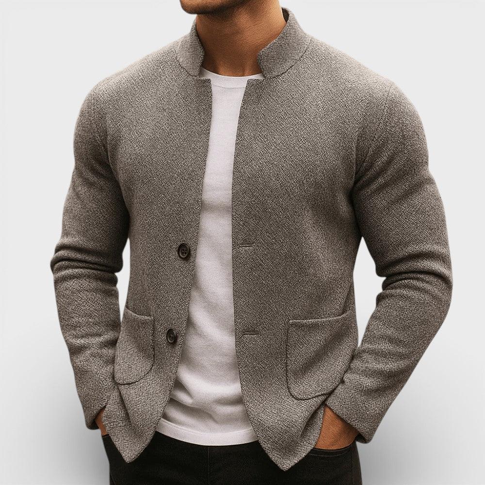 Gray knit blazer with two-button front and flap pockets