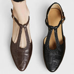 Brown and black leather Mary Jane sandals with openwork strap and buckles