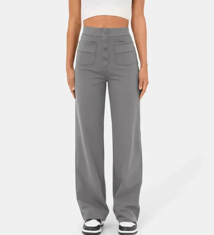 Light gray elastic waist pants with wide legs, front buttons, and patch pockets