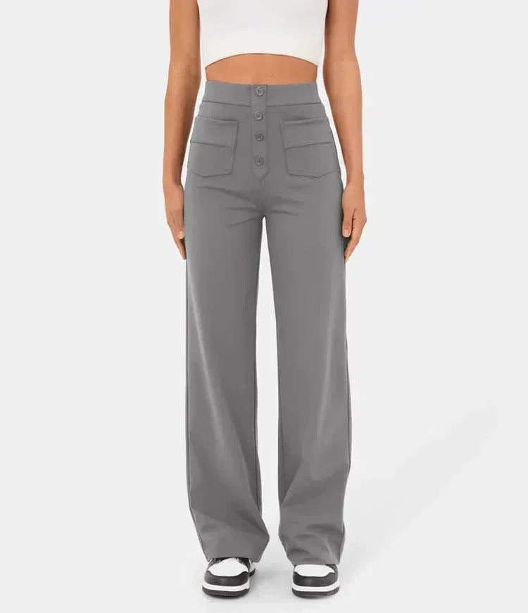 Light gray elastic waist pants with wide legs, front buttons, and patch pockets