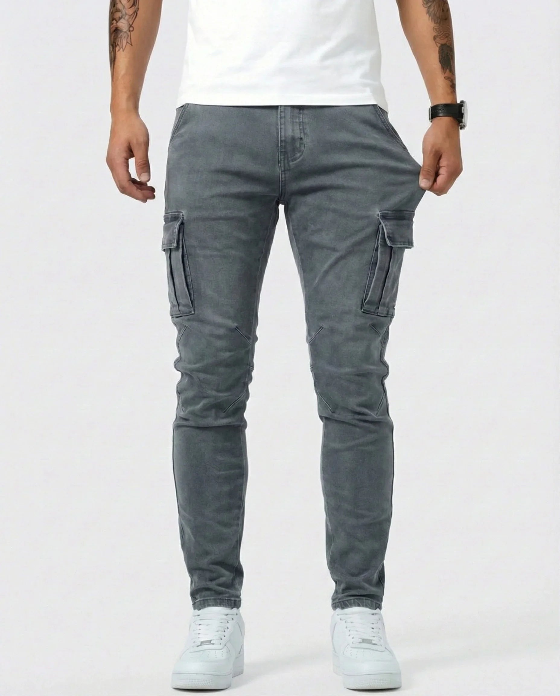 Gray elastic cargo jeans with side cargo pockets and slim tapered legs