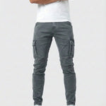 Gray elastic cargo jeans with side cargo pockets and tapered ankle cuffs