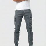 Gray elastic cargo jeans with side cargo pockets and tapered ankle cuffs