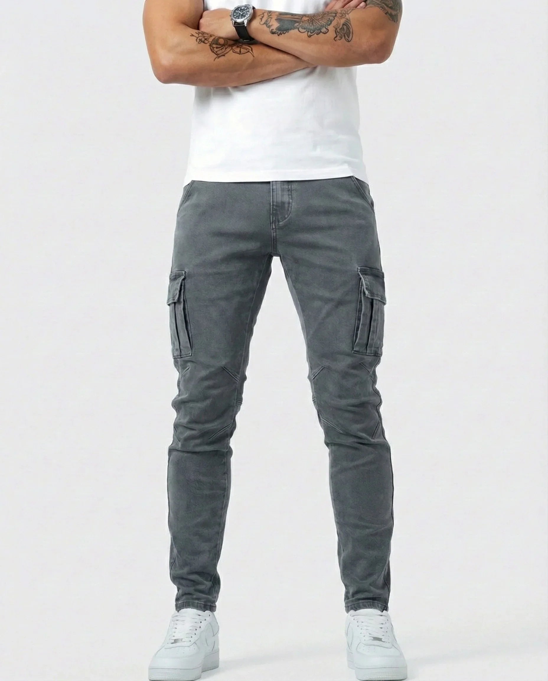 Gray elastic cargo jeans with side cargo pockets and tapered ankle cuffs