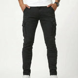 Black elastic cargo pants with thigh pockets, tapered legs, and ankle cuffs
