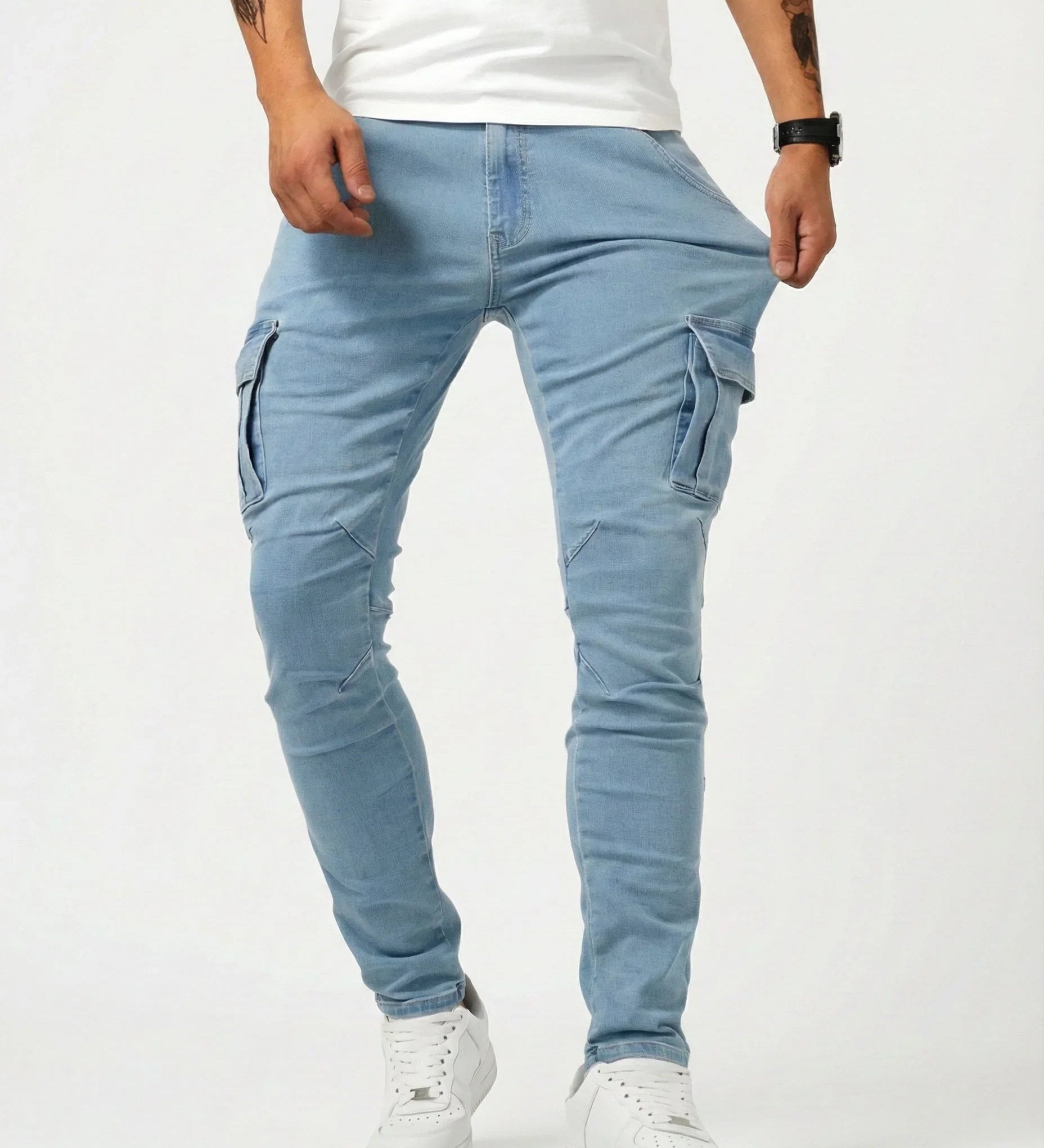 Light blue elastic cargo pants with side thigh pockets, tapered legs, ankle cuffs