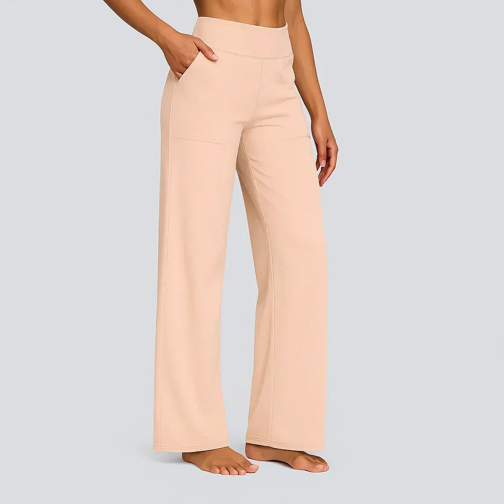Wide-leg high-waist pants in light apricot with front pockets and belt loops