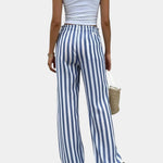 Blue-and-white vertical striped pants with elastic waistband and wide legs
