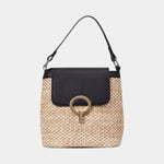 Knit style bucket bag with black flap, ring clasp, and crossbody straps.