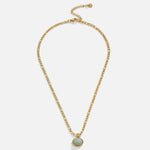 Gold chain pendant necklace featuring a centered oval green stone drop