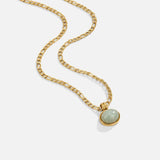Gold curb-link pendant necklace with oval green stone in a gold bezel