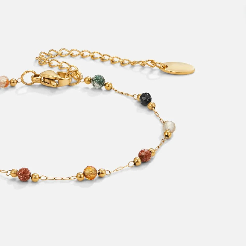Gold beaded bracelet with multicolor stones and small clasp closure