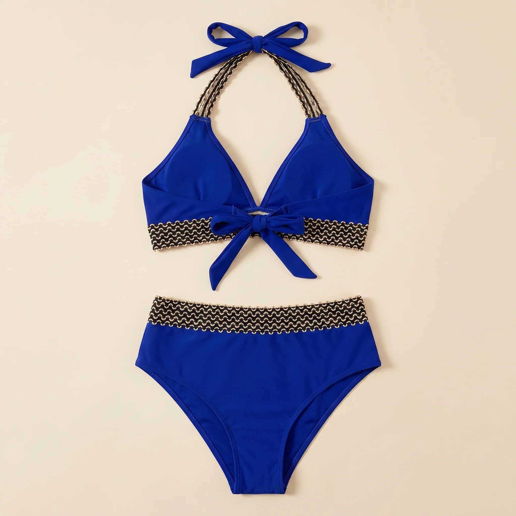 Navy blue triangle bikini set with crocheted zigzag trim and halter bow ties, briefs