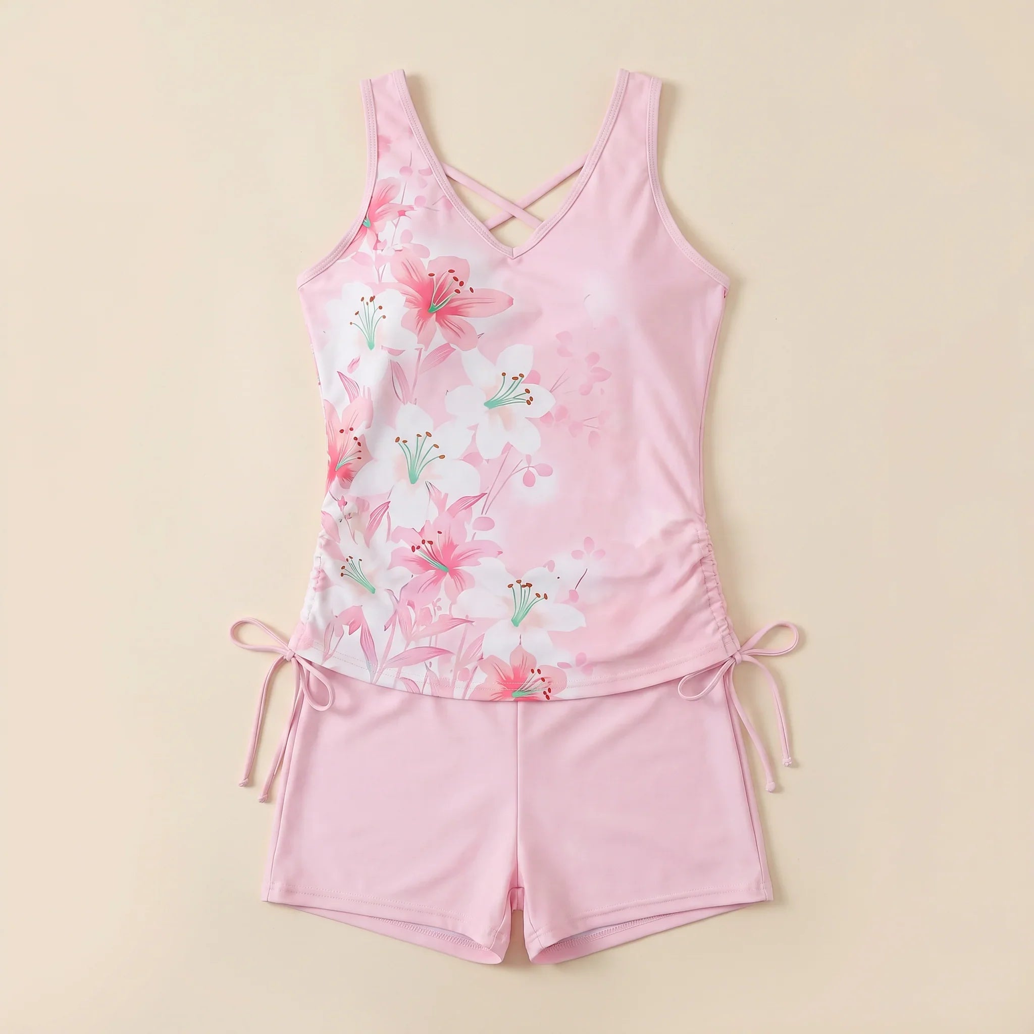 Pink floral tankini set with crisscross V-neck and matching drawstring shorts