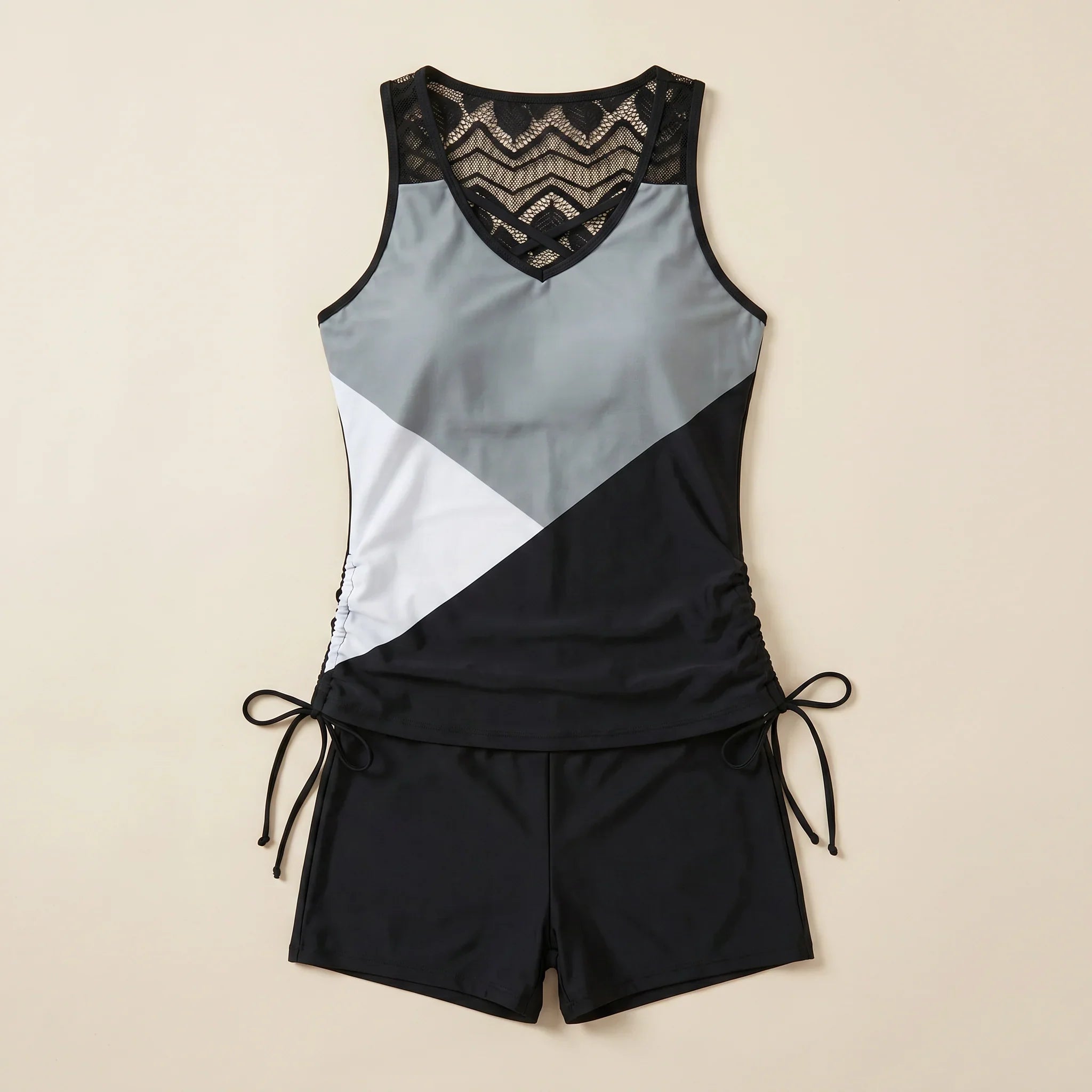 Colorblock tankini swimsuit with patterned V neckline and tie-side swim shorts