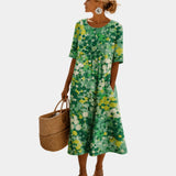 Green floral midi dress with short sleeves, scoop back, gathered skirt