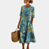 Blue floral midi dress with short sleeves, scoop back, gathered skirt