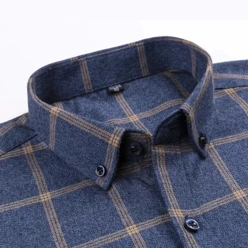 Navy checkered dress shirt collar close-up with tan plaid and dark buttons.