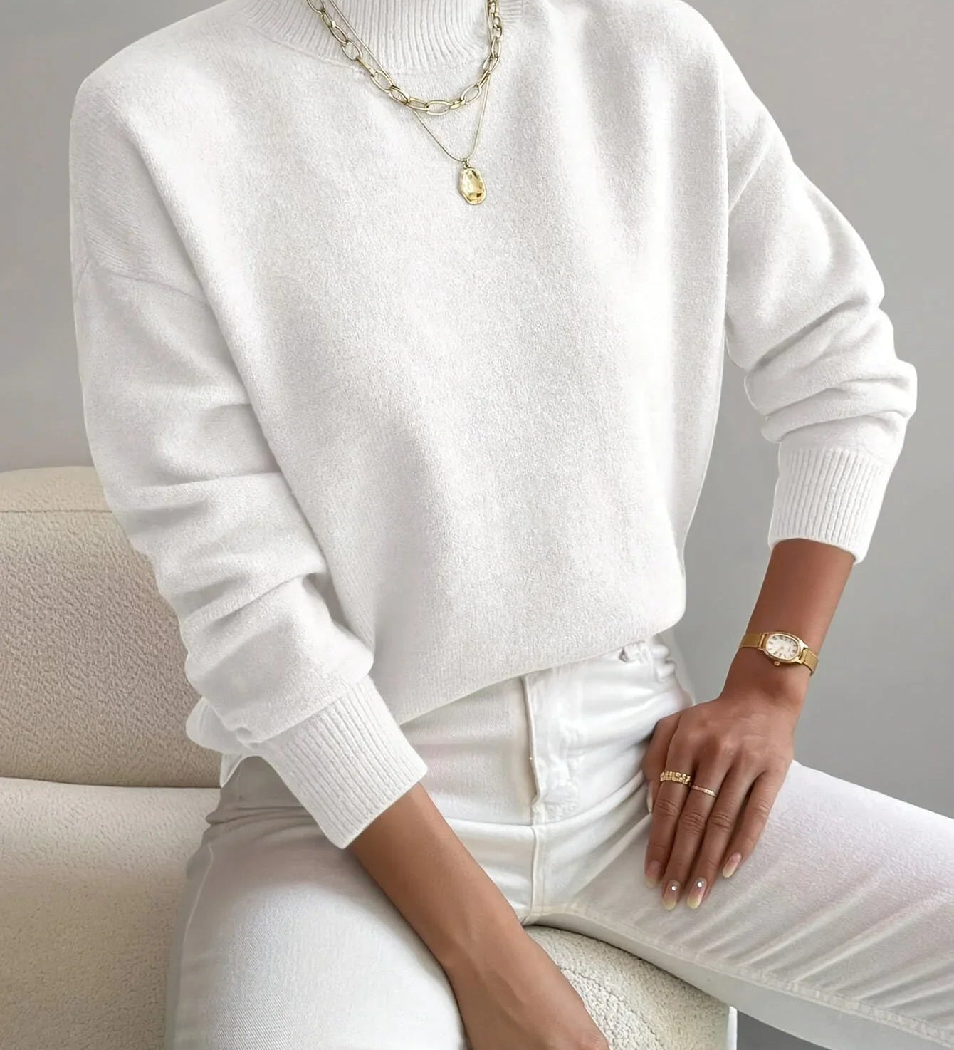 White knit crewneck sweater, long sleeves, ribbed cuffs and hem, relaxed fit