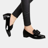 Black slip-on loafers with buckle strap and block heel