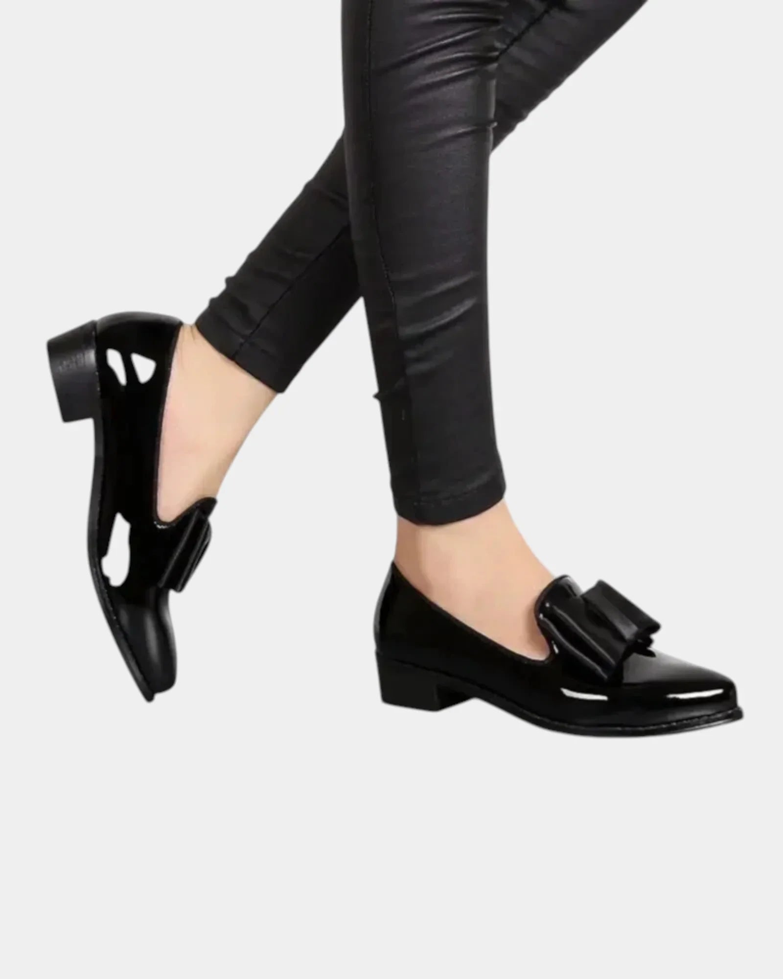 Black slip-on loafers with buckle strap and block heel