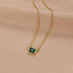 Gold-plated necklace with green emerald square pendant on a thin chain
