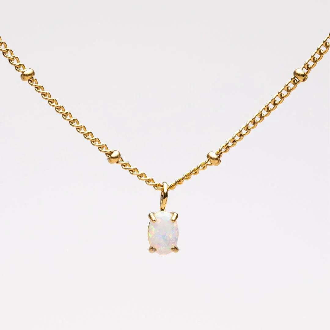 Gold opal pendant necklace with link chain and round opal centerpiece
