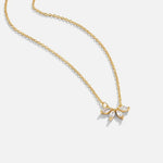 Gold-tone crystal leaf necklace with shimmering leaf-shaped pendant cluster