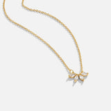 Gold-tone crystal leaf necklace with shimmering leaf-shaped pendant cluster
