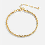 Gold chain bracelet with braided centerpiece and secure clasp