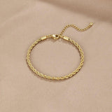 Gold braided chain bracelet with clasp and short extender loop