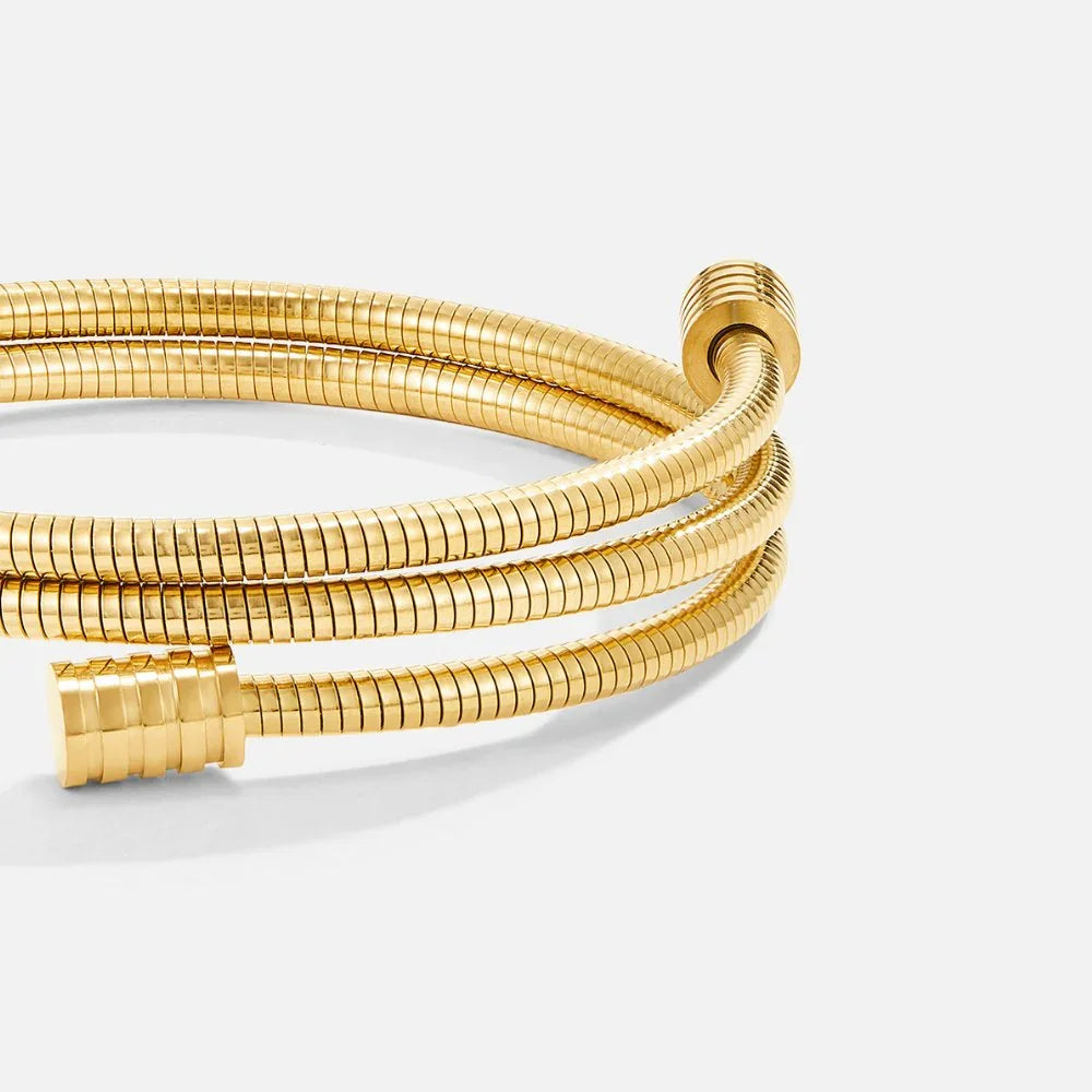 Gold coiled multi-strand bracelet with ribbed texture and clasp