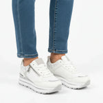 White women’s lace-up comfort sneakers with zip detail and cushioned tread sole