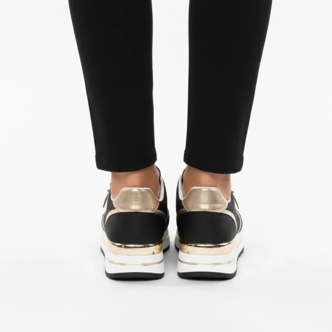 Black women's sneakers with metallic gold heel and white midsole