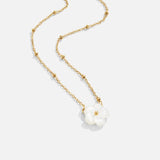Gold layered necklace with two white flower pendants on linked chain