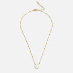 Gold flower pendant necklace with white bloom charm and extended chain