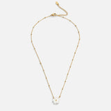 Gold flower pendant necklace with white bloom charm and extended chain